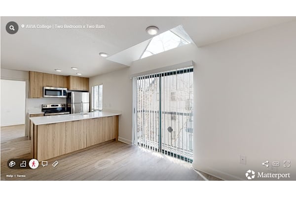 Kitchen with wooden cabinets at Avia Apartments on College Blvd (Overland Park), Overland Park